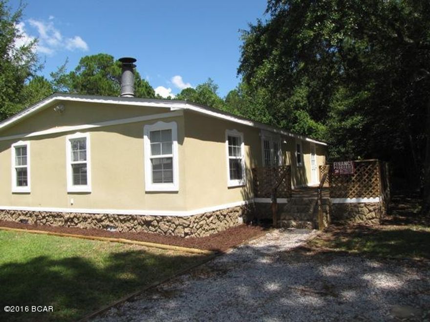 WOW !! NOT YOUR TYPICAL MOBILE HOME. This home has been COMPLETELY RENOVATED with BRAND NEW A/C Unit, Stove, Dishwasher, Microwave, Sinks, Counters, Fixtures, Lighting, Carpet, Paint, etc, plus the exterior has been covered with Architectural Styrofoam and sprayed finish. Conveniently located in the desirable Deerpoint Lake area. 3 Bdr 2 Bth, Living Room + Family Room with Fireplace, Laundry Room with BIG Storage Cabinets, BIG OPEN KITCHEN with Custom Wood Cabinets, Split Floor Plan, BIG Master Bath with extra storage, Tile Flooring except for New Carpet in Family Room and Bedrooms 2 & 3. Tile Tub Surround in both Baths. Nicely Landscaped Front Entry plus BIG COMFORTABLE SHADED DECK with French Door entry to Family Room. Possible Seller Financing. DON'T MISS OUT - SEE THIS ONE TODAY !!