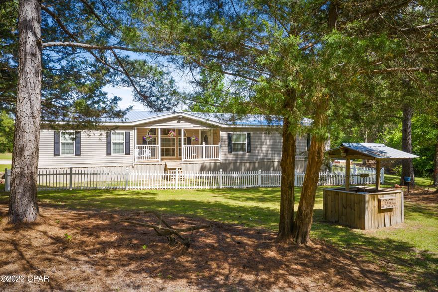 This beautiful 5+/- acre property has everything needed to live the country life right! Located just minutes from Bonifay this 4 bedroom, 3 bath mobile home boasts engineered hardwood floors, formal dining room, spacious living room with woodburning fireplace, an eat-in kitchen with an abundance of cabinets, breakfast bar/island, travertine floors and stainless-steel appliances. The split floor plan provides plenty of privacy for the master suite that features double vanities, soaking tub, separate shower and a massive walk-in closet. Outside features include a 18x36 inground saltwater pool, hot tub, 24x36 workshop/storage room, 48x34 pole barn and front and back porches. Property is located off a paved road minutes to Hwy 79.