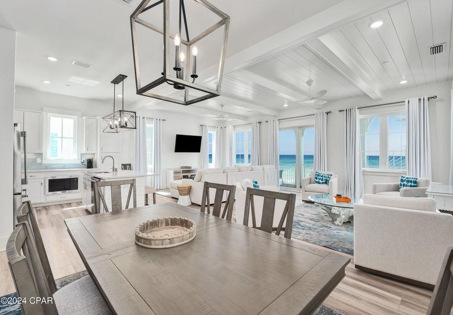 MAJOR PRICE CHANGE, JUST DROPPED 150,000! MOTIVATED SELLER, BRING OFFERS! THIS 6 BEDROOM 6.5 BATH GULF FRONT WITH PRIVATE POOL IS READY FOR THE SUMMER! Enjoy your time at PCB's Margaritaville Resort in one of the Best Gulf Front Luxury Beach House in the Resort.  Unit 3 has the Best Gulf Views and as well easy access from Front Beach Road but that's not all, this unit was customized by the owners with a different furniture package and decor to make it special. In addition,the home has never been rented but can be put on the Margaritaville rental program immediately if so desired. The Oasis Floor Plan features offer 3990 SF of living space with an endless view from the balconies on each floor with Two Master suites on the Third Floor.  The First Floor offers a Recreation Room with Mini-Kitchen, and a with a gaming area with foosball table, Bunk Room and an Elevator as well as entry to the oversize deck featuring a Private Pool, oversize deck with Grill & a Private Beach walkover with outside shower.  The second floor features the living area with an open Great Room that opens to an oversize balcony with endless views East and West, Two Bedrooms with Ensuite Baths and a large laundry with additional storage.  The Third Floor offers three bedrooms, all with ensuite baths, with two being master bedrooms on the Gulf side with endless views of the coastline of PCB. All this with the amenities of Margaritaville PCB Resort including, The Salty Rim Bar & Grill, Fins Restaurant and Bar, (opens in 2024), and a 425-foot lazy rive Lagoon Pool that is Margaritaville's signature at each of their Resorts.  Get ready for good times as it's 5 o'clock somewhere at Margaritaville Resort. Food and Beverage bar area is now open at Pool side in the resort, come join the fun as Margaritaville Cottage Resort takes shape.