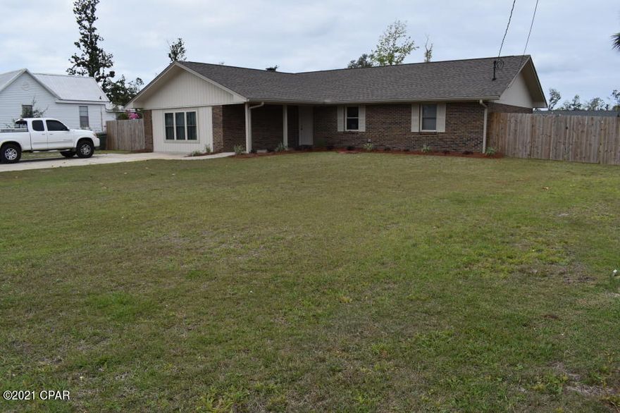 CURRENTLY UNDER CONTRACT, SELLER ACCEPTING BACKUP OFFERS. Spacious Family Home in quiet neighborhood near Lynn Haven Elementary School.  Sturdy brick construction with a roomy 1991sf split floor plan with many newer & lovely upgrades. Total 2246sf under roof including covered porches.  Situated on a large 100x150 lot with an outbuilding in back yard & plenty of room to drive thru side gates.  Interior of the home features a huge family room with fireplace, open concept plan to kitchen.  Recent renovations include a beautiful New Kitchen (2020), New Windows, Doors, Vinyl Plank Flooring, Metal Roof & Privacy Fence (2019), Remodeled Outbuilding now features a separate room for Man Cave, Kids Playhouse, etc. & other side of building is for Storage or Garage. New HVAC system, Renovated Bathrooms & Master Suite (2017). This home has so much to offer!  And this home is located in beautiful and popular Lynn Haven.  This community offers terrific amenities such as a large bay front park with several boat launches, a beach, playground and picnic areas.  There is also a huge bay front park nearby with a large new playground, splash pad park, ball field, and waterfront pavilions. There are other great parks as well including an Amphitheater park & playground for concerts and festivals.  And most importantly, the schools in the area are excellent and preferred by many.  The City is also in the process of building a new Library and City Hall.