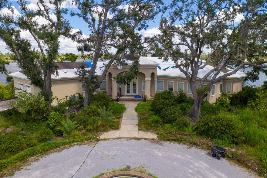 CURRENTLY UNDER CONTRACT, SELLER ACCEPTING BACKUP OFFERS.  One of the best waterfront locations in Bay County!  4 ACRES with a panaramic view of Fanning Bayou tucked away at the end of Oak Harbor Rd in Southport.  The only bridge between the dock and the Gulf is the Hathaway.  House has some hurricane damage and will require remediation.  Dock appears to be in good shape.  4 BRs, an office/study and a media room!  Amazing views of the Bayou from almost every room!  There is a pond on the property as well as numerous plants, fruit trees and wildlife.  Fully renovated, this could be a million dollar home.  All sizes, measurements and dimensions are approximate.  If important, buyer please verify for accuracy.