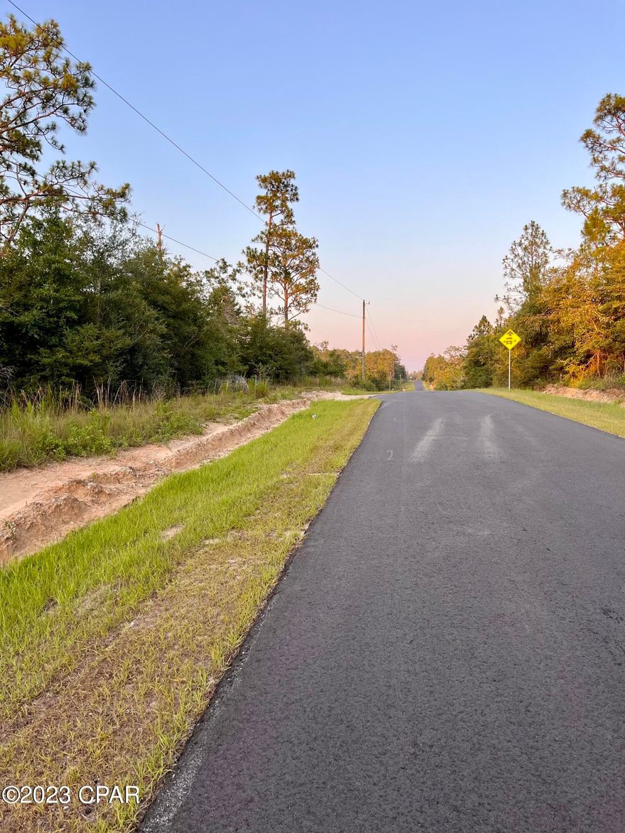 Two and a half acres of unrestricted land in Southern Washington County. The land is mostly wooded, and there is an old block structure that is built into the land about 300' off of the road. It appears to be an old house, but it is unclear if it ever had utilities or if it was permitted. There are no county records on the property appraiser site. It is deemed no-value and all contents in the structure and the property convey with the sale. The seller is selling it ''as-is'' and nothing will be removed. This spot is less than an hour to the beach and in the midst of a lot of freshwater lakes. Between Hwy 77 and 79, it is the perfect spot for convenience to PC or PCB.