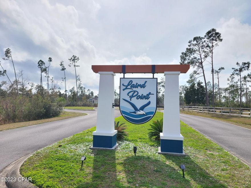 The waterfront, gated community of Laird Point is a hidden gem and you have an opportunity to make it HOME! This vacant lot is a perfect place to build your dream home with the opportunity for waterviews of the Bayou and the Bay from the front AND the back of the home. This lot is cleared and ready. At .27 acres, there is plenty of room for your home, nicely landscaped yard, a pool and firepit while enjoying the Bay breezes grilling on the porch! Your coastal lifestyle awaits. LOW HOA dues, golf cart neighborhood, with a gate, community RV and boat storage and tennis courts and underground utilities all make this community worth establishing roots. Close to grocery stores, restaurants, TAFB and more! This area is the next large growth area of the county, so dont let this one get-a-way