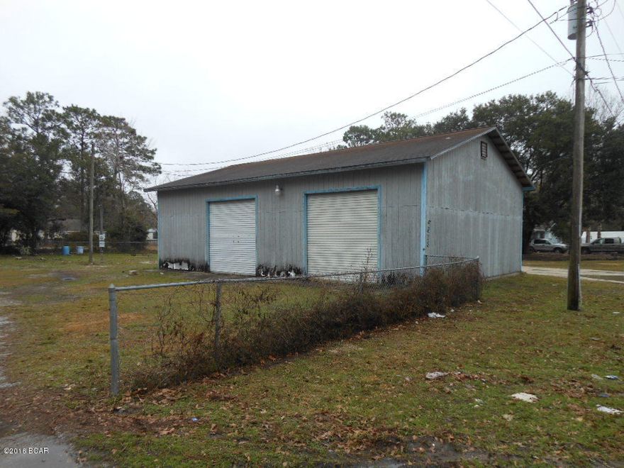 You're looking at a most unusual property. In the front is a large, 1440 s.f. garage type building with 3 large, roll up doors. In the back of the property is a shell of a 1080 s.f. house. The house is in poor condition and has no value.  The price reflects this. For the right buyer, this parcel has several possibilities. One being the building would be a great place for a hobbyist with all kinds of tools and equipment. Check with your Realtor today to see if this would work for you !!