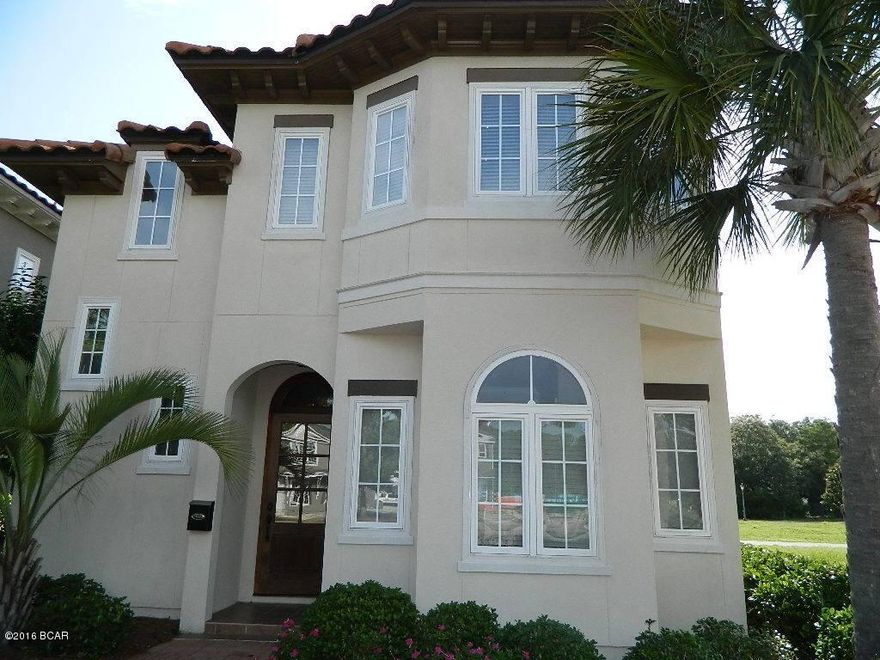 Distinctive Tuscan style home in the gated waterfront community of Magnolia Bay Club. The Falcon 2-story plan has an open flow, travertine flooring, high ceilings, gas fireplace, oversized crown molding. Gourmet kitchen features custom cabinetry, granite, Frigidaire Gallery Series stainless appliances, gas stove, wine cooler. The dining area opens onto a covered patio, bbq area. First floor Master Suite with second Master, two large bedrooms, guest bath are on the second floor. Attached 2-car garage off the rear. Bay-Front swimming pool, dining pavilion, gas grills. Clubhouse with fitness center, restrooms, TV lounge, billiards/ping pong. Children's playground. Community dock, beach with kayaks for owners. Convenient location to schools, Navy base, shopping, dining. A beautiful community!