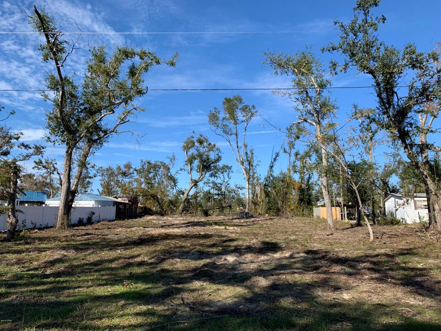Spacious lot on a quiet dead-end road across from wonderful views of Deer Point Lake. The parcel has been cleared post-Hurricane Michael with some surviving beautiful trees! Perfect for a new construction weekend getaway or to place an existing mobile/modular home. Only .8 miles from David Hutchison Park with public boat ramp, fishing pier, pavilion, playground and picnic park! THIS WON'T LAST LONG!