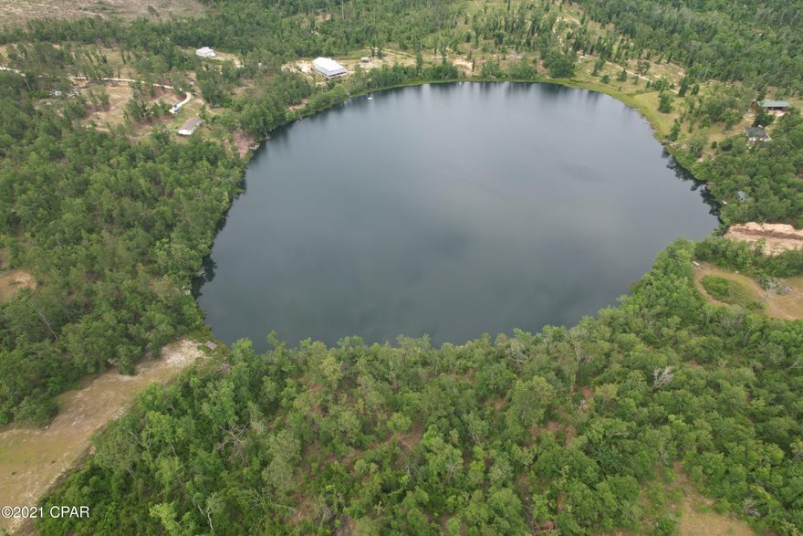 Looking for a place to build your dream home with access to a 14 acre pond this is it! This 13 acre parcel has lots of paved road frontage and nice oaks for shade. It has over 100 feet of water frontage and lots of privacy. There are new homes being built close by. Just a short drive to Marianna, Alford, Hwy 231, interstate 10 and only a 45 minute drive to the world's most beautiful beaches.