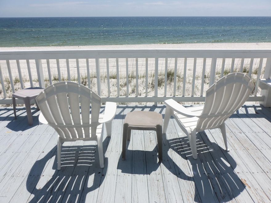 RARE GULF FRONT BEAUTY!!! Stunning contemporary  4 BR 4 bath 1 level home...AWESOME GULF and BEACH views East to West as far as the eye can see!..9' ceilings throughout, crown moulding, Large open living area includes living, dining, kitchen and breakfast bar all with full beach view..New Quartz counters in kitchen...GULFVIEW and access to deck & beach from master and 2nd BR...Freshly painted inside and out.. Huge 40' wide deck overlooking the beach..Storm shutters on all windows..Large double garage provides secure entry (A rare find in a gulf front home) You will not beat this beach front property with sunset  &  million dollar views!!...All it needs is YOU!!