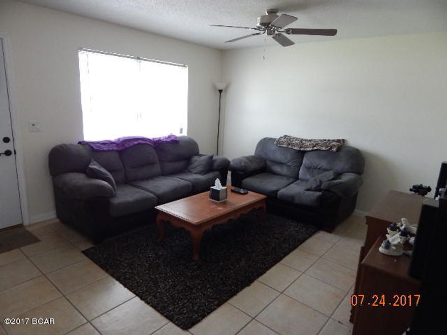 Nice all-brick, 3 bedroom, 2 bath home with attached 1-car garage in St. Andrews area. Large privacy-fenced backyard, fire pit, mature trees, and storage shed. Front yard has an automatic sprinkler system.  Roof is only a few years old and attic access for extra storage in the garage. Updated with modern appliances, tile floors in most of the home except bedrooms, and energy-efficient double-paned windows. Home comes with PYLOX hurricane window clips & boards pre-fit for every window, transferable termite bond, and is wired for a small generator. Seller also just installed fresh coat of paint. All measurements approximate, please verify if important.