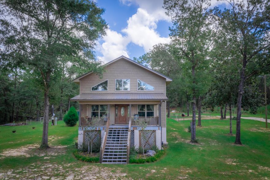 CURRENTLY UNDER CONTRACT, SELLER ACCEPTING BACKUP OFFERS - Custom country built estate located in Washington County.  You will definitely not want this one to pass you by!  It combines both luxury & comfort in a rustic decor. The master en-suite located upstairs even has it's own laundry room while the main level has a spacious open concept kitchen/dining & living room.  Want a bon-fire without the smell and the cold weather? The living room is sure to set the mood with an electric fire-pit in the comfort of your living room.  There are so many extras to include custom knotty alder wood cabinets, granite counter tops, stainless appliances, breakfast bar w/stools, a mud room w/double sinks to groom your pets, a furniture lift for upstairs, a detached 3rd bedroom joins the 2 car garage, whol This home is very energy efficient and has blown in foam insulation in the floors, walls & ceilings, an on demand hot water heater, 2 carrier unit heat pumps, and it has double pane insulated windows.  Also, there is a 50 AMP plug for RV with water & sewer hookup next to the garage.  Home also has a current termite bond!!! Be sure to check out the virtual tour!