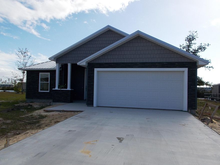 REDUCED NEW CONSTRUCTION. This stunning 4 bedroom/2 bath WATERFRONT home is a dream come true! The lakefront property is located on a street with a cul de sac.  Landscaping is l to finish by December 15th. The exterior has smart, low maintenance vinyl siding & a 40 yr metal roof. The lakefront porch features a large patio to accommodate an attractive outdoor living area. This split bedroom, open concept living area plan provides fantastic lake views!  All flooring is upgraded vinyl plank. The kitchen features solid wood cabinets with wooden butcher block countertops including the breakfast bar/island.  Master bedroom has a trey ceiling. The 4th bedroom can also be an office.  One year Comprehensive Builders Warranty conveys. Listing Agent is builder's spouse.  This beauty won't last long. Updated photos will follow as work is completed.