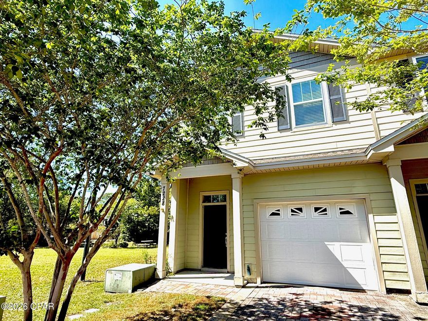 Imagine owning a stunning place in a private, tranquil townhome community that feels like a resort, minus the crowds. This impressive three-bedroom, 2.5-bath end unit has been beautifully revamped with fresh paint and sleek vinyl plank flooring, complete with a garage for added convenience. Nestled beside a picturesque green space, picnic area, and dog park, this haven offers the perfect blend of relaxation and recreation. The serene back patio is ideal for sipping coffee and enjoying a sense of calm, while the community's fitness center and pool provide endless opportunities for wellness and leisure. With pristine beaches, St. Andrews Bay, and a variety of water sports and seafood options just minutes away, this incredible location offers the ultimate lifestyle. Plus, its proximity to the Navy Base makes it an attractive option for those serving. Whether you're seeking a primary residence (ask about some incredible first time buyer programs) or a savvy investment opportunity, this property boasts impressive potential for rental income, with estimates exceeding $2100 per month. Don't miss this opportunity!