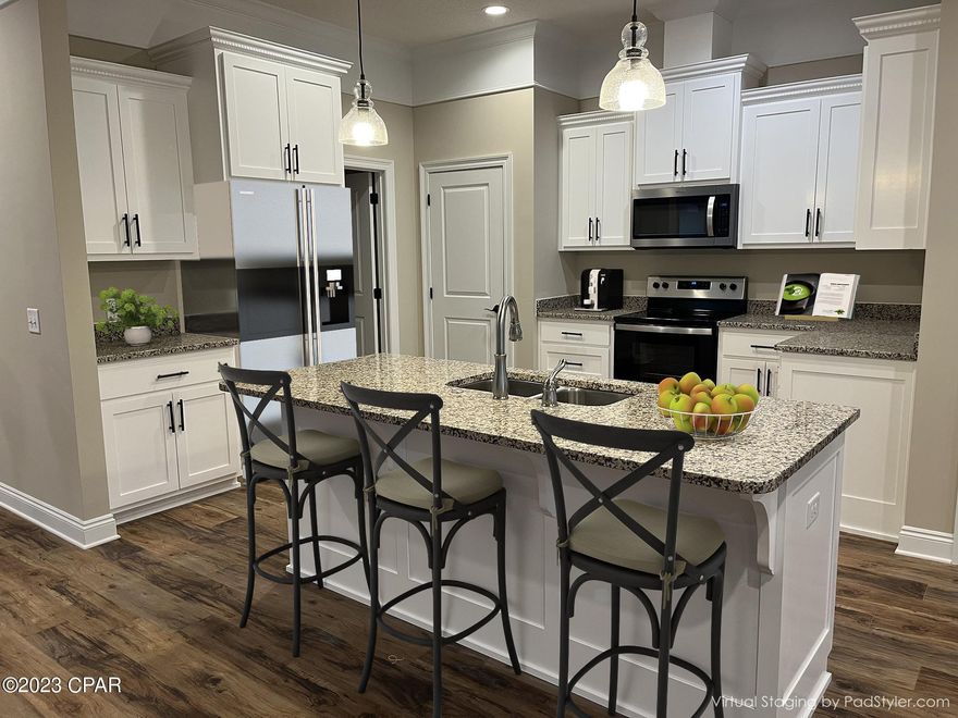 Now Affordable, Get 5% Rate on Financing with builders prefer lender & 2-1 buydown on this Upgraded new Construction well-built 4-bedroom 2-bath all brick home. With an oversize 2 car garage & emergency generator hook-up. Large open floor plan with Florida Room, outside patio and hot & cold outdoor shower. Large master bedroom has a separate office or sitting area, walk-in closet, tray ceilings with rope lighting and the bathroom has walk-in shower with seat & double vanity. Nice size additional bedrooms & closets, including all your blinds. The house has large open family room with electric fireplace, high ceilings with crown molding and LVPs throughout house. The big kitchen has an island, custom real wood cabinets and SS appliances. security system included. A new privacy fence has been added. Back patio with outside shower. If you're looking for a very large house with lots of room this is it. If important information and measurements should be verified. House was staged for photos.