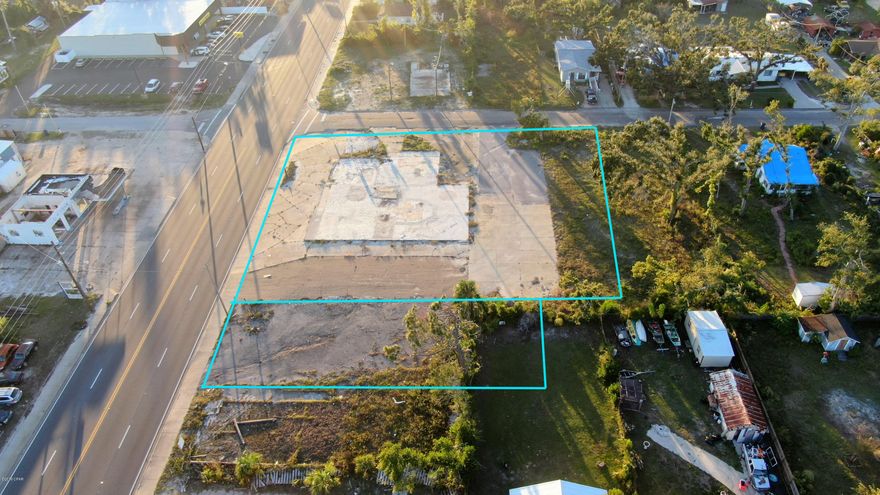 Former site of Bottle Stopper Lounge & Package Store. Traffic count 21,000 cars per day. Wide open Corner Location with excellent visibility & traffic count. Building sustained hurricane damage and has been demolished & removed. Adjoining parking lot conveys with sale. Entire site is ready for a new business. Water & Sewer available & on site previously. Foundation slab has been left in place all debris has been removed. Many possibilities for this site - restaurant, retail, business with easy access, office. Two parcels convey with sale: ID# 22663-000-000 and 22665-000-000 (1.14 AC+/-) or 80' x 130' lot on East side can be sold separately. See MLS #691182 for that listing.