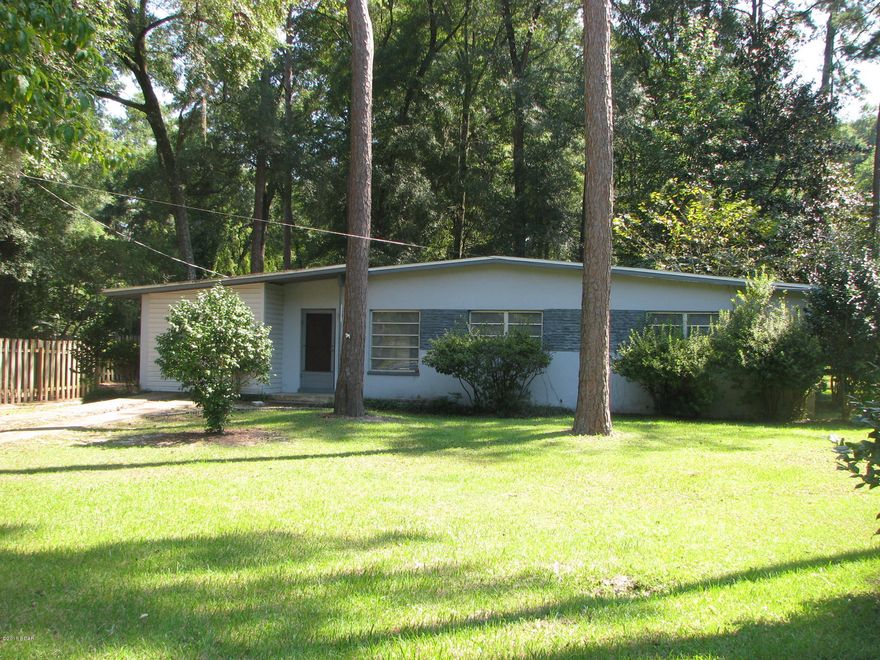 Nice starter home in downtown Marianna. This home has been used for a rental in the past and needs a little TLC to bring out its full potential. There are two spacious living areas in the front of the home and three nice sized bedrooms towards the back. Home is conveniently located near all of the local schools. It is minutes from plenty of shopping and dining as well. It has a large backyard with plenty of shade and is also partially fenced.