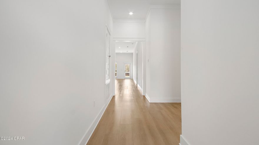 Welcome to 425 Newman Bayou Blvd, one of our newest additions to Breakfast Point in Panama City Beach. This thoughtfully designed single story home boasts 2,300 square feet of naturally lit open living space and modern finishes. The Pier features four bedrooms, three full bathrooms, and a spacious three car garage.
As you enter the foyer you will pass the first of three guest bedrooms just off the foyer and next to the first full guest bathroom. Continuing to the heart of the home, a large open concept awaits filled with natural light from the many windows and elevated ceilings. The large kitchen island overlooks the dining and living area. The kitchen is dressed in quartz countertops, Herringbone tile backsplash, EVP flooring, and complete with a single basin undermount sink in the island. This home offers plenty of storage including a large walk-in pantry and various linen closets.
Near the kitchen, you'll find a secluded hallway leading to the primary suite, tucked away in the back of the home. In addition to added privacy, this bedroom offers elevated ceilings and large windows. The beautiful bath ensuite is complete with an oversize tile shower, a dual sink vanity with quartz countertops, and a large walk-in closet with shelving - truly a dreamlike space. The laundry room is also conveniently located at the other end of the hallway.
All three guest bedrooms can be found on the other side of the home along with the two full guest bathrooms. 
Beyond the interior features and details, every home is equipped with Smart Home Technology. This thoughtful integration of technology ensures that your new home is perfectly designed to meet the demands of modern life. Enjoy quality materials and workmanship throughout, with superior attention to detail, in addition to a one-year builder's warranty. We would love to give you a tour of our Pier plan today.