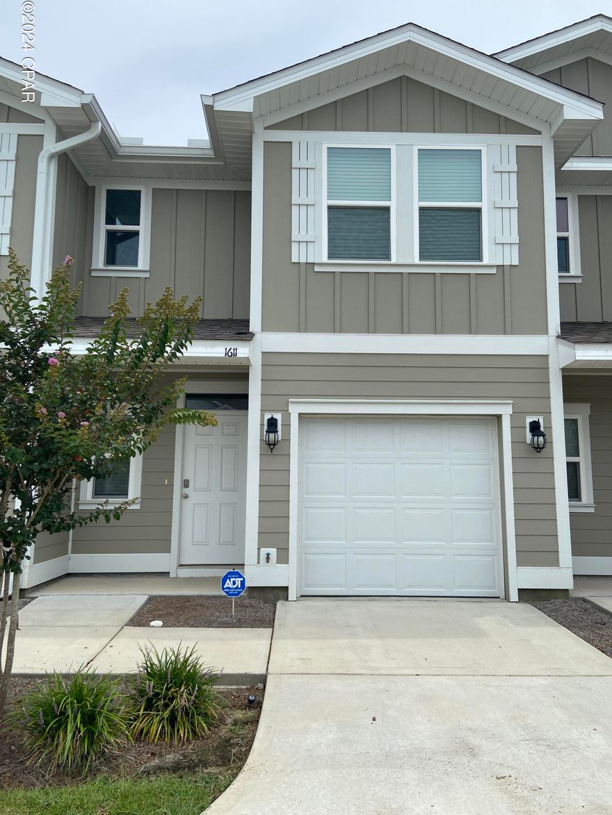 ** 1/2 OFF FIRST MONTH'S RENT ** LIKE NEW 3BD 2.5BA TOWNHOUSE W/ GARAGE in the heart of Lynn Haven and near Bay County's most requested charter schools and also near Mosley High School - Come enjoy the maintenance free lifestyle with no yardwork... LVP flooring & new carpet, granite counters, stainless appliances, shaker-style custom cabinets, huge pantry, breakfast bar that can seat four, recessed lighting, upgraded ceiling fans & fixtures, lots of closet space! W/D hookup upstairs by your bedrooms! Covered back patio. Landscaping included. Pets negotiable, restrictions & pet fee apply.