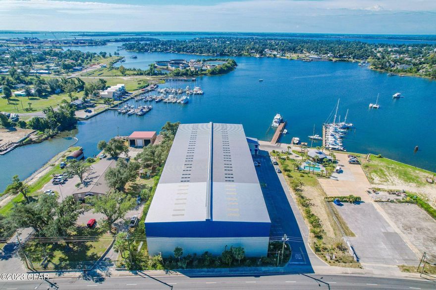 UNDER CONTRACT!  TAKING BACKUP OFFERS.  Take a look at this like new beautiful full service - turn key Upscale Marina for sale in the Bay County Panama City Florida area.  Marina was fully constructed in 2016 and consist of  a 44,228 square foot barn for inside storage capacity of up to 240 boats and 2 Taylor boat forklifts.  The barn has 3 rows and can easily accommodate a 32 ft boat.  Marina is on a 2.5 acre parcel for additional growth such as an outdoor . restaurant, service department etc.  The outside wet slips consist of 15 and accommodation of long term rental or transit.  On the premises is a large Tiki bar, kitchen. Take a dip on the pristine pool after a long day of fishing..  Fuel depot on site, gift and bait shop and a large 1800 square foot  office.  On the second floor of the storage barn is a beautiful one bedroom one bath apartment overlooking the Bayou and Marina. An outdoor open air pavilion, 2 ice machines, 2 freezers, 11 courtesy racks, fish cleaning station and two additional large piers.  This is the only inside storage facility in the inner city of Panama City Florida with an estimated population of around 150,000.  New city public boat ramp being constructed two parcels down which will increase the fuel/bait sales and additional inside storage.  Bank appraisal accomplished in 2019 and available with proper buyer credentials. This will give a potential qualified buyer the actual value of the marina going back to 2019. Centrally located near restaurants and 5 minutes from downtown Panama City.  Easy access to the Gulf. Will consider Seller Financing with substantial down.