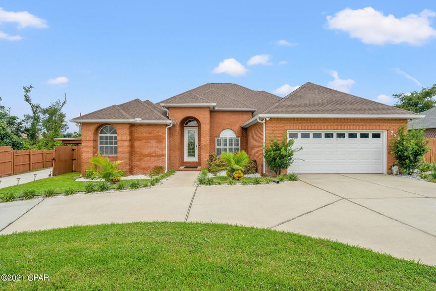 This home is stunning! This amazing home is a four bedrooms, three and a half bathroom all brick home with features inside and out that are sure to impress. Walk through the front door you will notice high end finishes throughout this home.  A formal dining area with decorative columns, 12 ft ceilings, and arch ways give a truly elegant look. A lovely newly remodeled open kitchen and living area with kitchen island overlooking the main living area and includes all new stainless steel appliances including dishwasher with wifi connectivity, granite counter tops, new water filter purification system.  The living room features a beautiful accent wall and an electric color changing fireplace. Whole house generator system.  The outdoor features of this home are amazing! A fully screened pool and and outdoor area with a heated and cooled pool house (included in sqft), and covered entertaining area. Newly built boat house with storage. Outside pool area lighting has been recently added, perfect for entertaining in your own backyard. Newly painted epoxy garage floor and newly painted outdoor entertainment area.