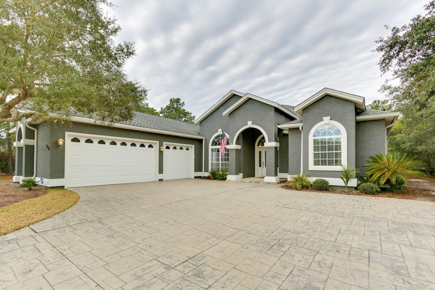 Beautiful professionally designed home located in the exclusive gated community of the Preserve On The Bay. This magnificent development is conveniently located close to great schools, shopping, entertainment and popular dining. The home invites comfort and exudes modern excellence, and just might be the most well maintained property in this beautiful community. You will fall in love with all the features and updates this property has to offer, from the stamped concrete driveway to the covered pool/hot tub. This home is nestled away on a peaceful cul-de-sac and has lovely tropical landscaping all around. Inside, this home has a generous amount of space boasting over 2,800 sqft, including 4 large bedrooms and 3 bathrooms. You will love the huge master bedroom and all the features it includes, as well as the private master bathroom which has a double vanity, whirlpool tub, separate shower and tile floors. The additional bedrooms have a vast amount of space and tons of storage. Become a master chef in the spacious kitchen featuring stainless steel appliances, granite countertops, walk-in pantry and breakfast bar. Tile floors run throughout the kitchen and the spacious Great Room, where you can enjoy gatherings next to your fireplace. Spend time outside with family and friends around the fire pit on the brick paver patio. The heated pool with a hot tub is also perfect for family fun all year round. The patio also features a screen covering, a gas hookup for BBQ's, and a hot water outdoor shower. Other features of this home include a three car garage, new wood floors, wired speakers throughout, new exterior paint, and the pool has been re-surfaced. This home is a must see and will not last long, schedule your showing today!