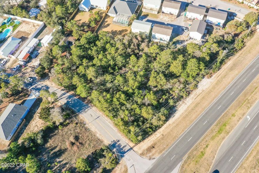 Nearly one acre of prime commercial land with 200' of Panama City Beach Parkway frontage. Ideally situated less than five miles from Inlet Beach / 30A and five miles from Pier Park, the future development  opportunities remain endless with an annual average daily traffic count of over 23,000. The median crossover adjacent from Azalea Drive provides easy access from both West-bound and East-bound traffic. The C-2 commercial zoning provides an array of permissible uses including retail centers up to 50,000 square feet, convenience stores, food service establishments, day care centers, mini warehouses, drug stores / pharmacies, and cannabis dispensing facilities with the proper approval.  Inquire today and discover why Panama City Beach remains one of the fastest growing areas in the Emerald Coast.