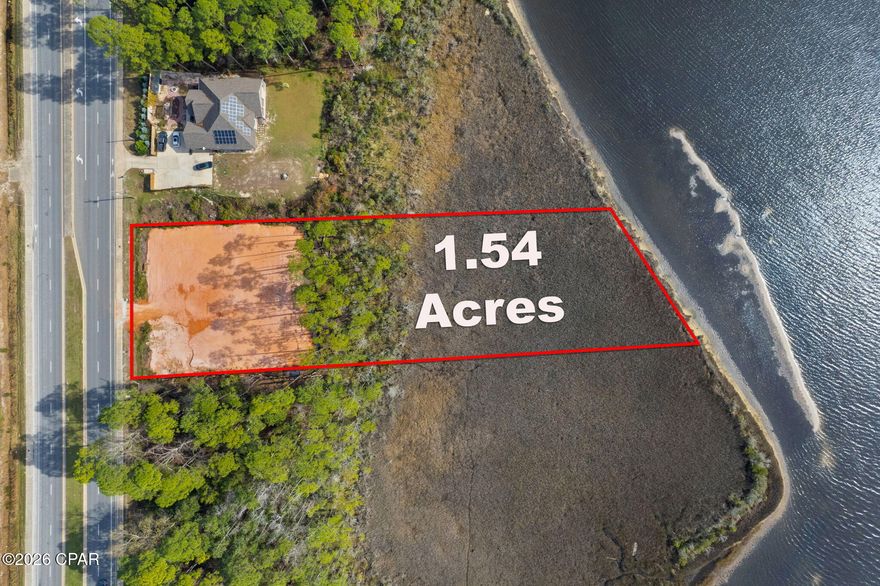 Life awaits on this fabulous build-ready waterfront lot on East Bay in Holley/Navarre. With over 1.5 acres and approximately 150 feet of waterfront footage, this rare opportunity offers the perfect setting to build your dream coastal retreat. Enjoy breathtaking views, free dolphin shows, abundant waterfowl, and soaring osprey right from your own backyard. The lot has been cleared, filled, and raised per Santa Rosa County permit requirements, making it ready to begin construction. Impact fees have been paid. Approved permits are in place, utility charges for water and fire services have been paid, and builder plans are included with the sale, saving valuable time and expense for the future owner. The included home plans feature a spacious waterfront design with 5 bedrooms, 5+ bathrooms, and both upstairs and downstairs family rooms, offering ample space and privacy for guests or multi generational living. Located conveniently on Highway 87 in Navarre, this property is not part of a subdivision, meaning no HOA and no association dues. A truly exceptional opportunity to create your custom waterfront dream home on East Bay.