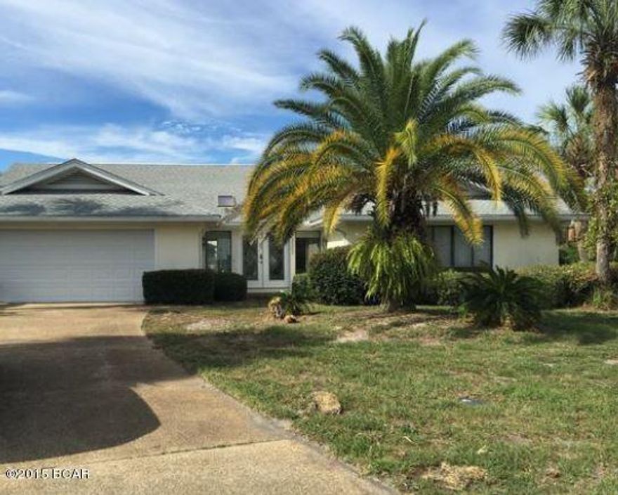 BEACH. FUN. Florida Paradise! Located minutes from the 27 miles of stunning white sand beaches and emerald green water, this sprawling ranch is waiting for its new owner. Yes, this one needs upgrading, with a little time, effort and your decorating ideas this home could be a diamond once again. The 4,327 sq ft includes three bedrooms, three full bathrooms, open kitchen with island, fireplace, two car garage and year round multipurpose room that opens to the pool. The Grand Lagoon Channel is your backyard. Panama City Beach does not disappoint with all of its amenities and active calendar. DONT MISS OUT! Submit your bid today.