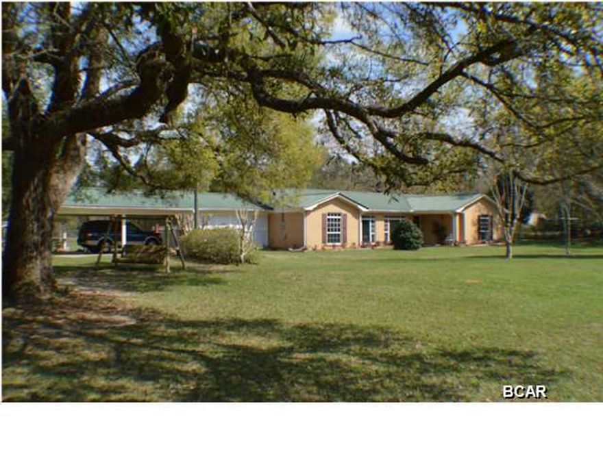 BEAUTIFUL 4/2.5 RANCH HOME ON 8.6 ACRES JUST SOUTH OF BONIFAY.RECENTLY REMOLELED OAK CABINETS GRANITE COUNTER TOPS TOP END APPLIANCES FLOORS ARE CERAMIC TILE BEDROOMS HAVE BERBER CARPET. 2 HUGE WALK-IN CLOSETS IN MASTER, DOULLE PANE WINDOWS AND INSULATED EX. DOORS. THERE IS A SUNROOM OFF THE MASTER BR. GREATROOM HAS FIREPLACE. THERE IS A NEWER OUT BUILDING AND LAND SCAPING. 2 WELLS AND A WELL STOCKED FISH POND. MUST SEE TO MUCH TO MENTION. MAKE YOUR APPOINTMENT TODAY