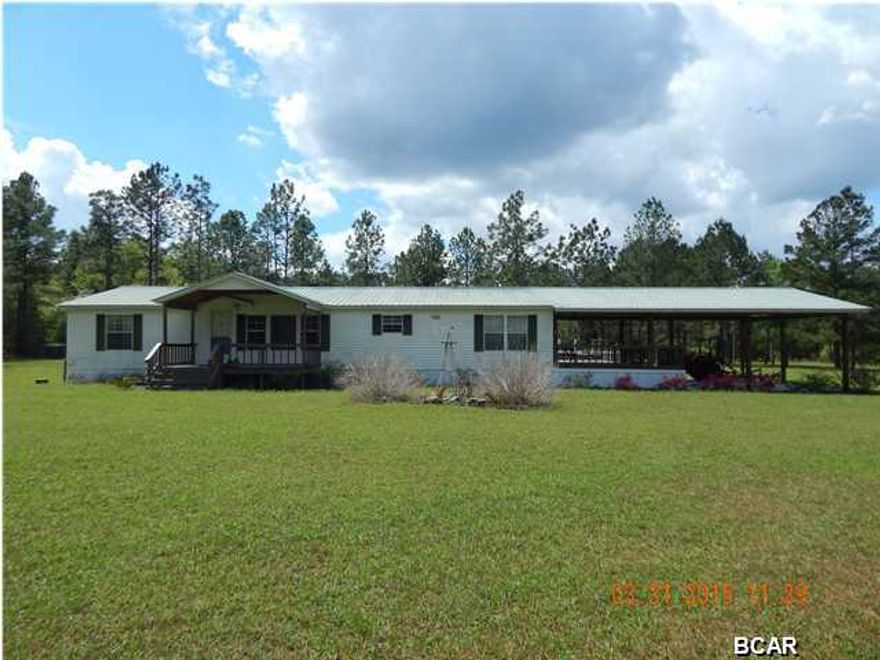 Lots of room for your imagination to run. Pastures on either side of the driveway entering this 2002, 3/2, well kept mobile home. If it's horses or livestock this property is ideal for both. Home has new metal roof,large covered deck, 2car carport. Open floor plan with large fireplace in living room. Master bedroom has a lg walk-in closet, an on-suite with double vanities, a garden tub and separate shower stall. The other two bedrooms also have walk-in closets. Kitchen has a breakfast bar and nook. This property has so much all it needs is you!