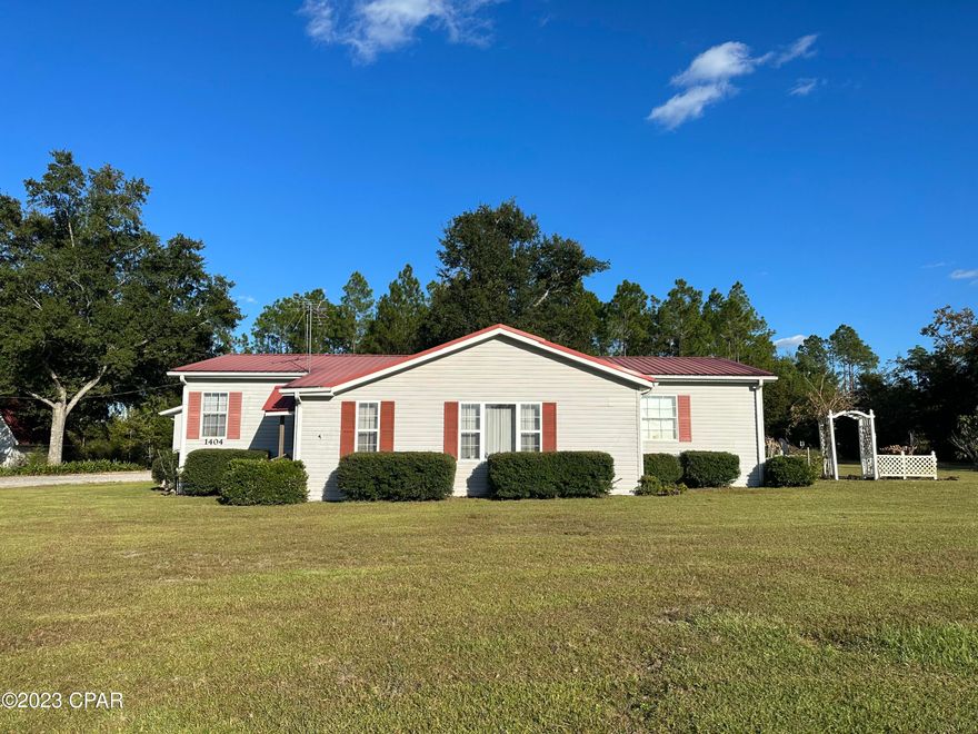 Spacious 3 Bedroom 2 Bath home on 10 Acres in the Cypress area, close to Marianna and Grand Ridge.  The front of the property is lined with beautiful crepe myrtles, with a nice driveway leading to the house. Park under a large carport or in a 44 X 24 metal garage with rollup door.  Garage has plenty of room for your tools, two work benches and a 12 X 10 office. Inside features a large living, dining and kitchen area along with a Florida Room just waiting for your plants.  The home has a split floor plan with three large bedrooms each with walk-in closets. The master bath has a walk-in tub and a stand-alone walk-in shower.  Home is handicap accessible. This home was made to enjoy the outdoors and indoors with a large 40 X 22 carport with a screened patio room just perfect for entertaining. If there wasn't enough room for everything, there is a small workshop with additional tool benches and storage up top.  The front of the property is cleared with a large landscaped front and back yard and the back of the property is wooded and is sure to have plenty of wildlife for you to enjoy.  The name of the game with this property is large and spacious.  Make an appointment today to see all this property has to offer.