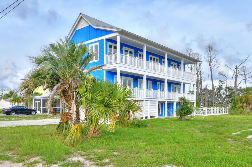 This amazing turn-key beach home is 5 bedroom/ 4.5 Bath with gulf views located in the quaint community of St. Joe Beach and sits only a half block to the dog friendly beach. The interior has beautiful eucalyptus hardwood floors and porcelain tile throughout. The counter tops are quartz and onyx in the kitchen and bathrooms. There are plenty of parking in the driveway and underneath the house, an outdoor shower with hot & cold water, in-ground pool. So many amenities to list. Comes fully furnished and Home Warranty!  Rental income is excellent and seller will cooperate with new owner to transfer rental list. On the first level there is a large family room, guest bedroom, guest bathroom and laundry room. On the second level there are two master bedrooms with French doors to the balcony and a luxurious en suite equipped with a double vanity and tiled walk-in shower and two guest bedrooms, each with 3 tier built -in bunk beds, and a shared Jack-n-Jill bathroom. All bedrooms have access to the 2nd floor balcony.
At third level you will find an elegant and roomy open floor plan perfect for entertaining with beautiful large windows and French doors.  An updated and fully equipped kitchen has all that you need to cook up a great meal with plenty of counter space that can seat up to 7 people. In addition to the living space on the third level, you can also enjoy the sitting area with the flickering of the gorgeous gas lanterns on the balcony that help add relaxation to a fun filled day. This spacious and tastefully decorated home has plenty of room to easily accommodate 16 guests. Great Investment opportunity!