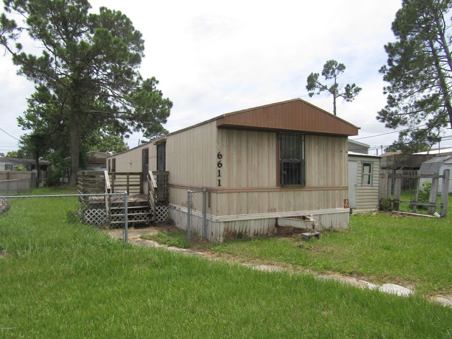 TLC SPECIAL! Are you looking to be close to the beach without breaking the bank? Here's your chance for under $65,000! This 2 bedroom/2 bathroom, mobile home located just a couple of miles from the beach could be your new getaway. 938 square feet and 0.143 acres of land ready for it's new owners. A little tender love and care could bring this home right back to life. Appliances stay and so does the storage shed! Call today to schedule your tour, but don't wait, or you might miss it!