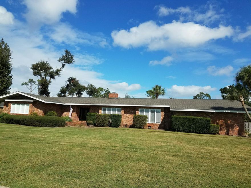 Currently under contract, sellers accepting backup offers. Sprawling ranch home featuring a boat house & lift with DEEP WATER ACCESS (4-7 ft. depending on tide) that is less than 1 mile to the open bay! This all brick home has room for the whole family. The stunning back yard that is a perfect place for a ''stay-cation'' and entertaining.  The lawn is beautifully landscaped & features an in-ground pool plus a fire pit & expansive patio area. Upon entering the front foyer you will find a large formal living room & grand formal dining room, each with large windows that allows massive amounts of natural light to warm your spirit! From there you wander to the open & airy family room featuring a brick fireplace. The kitchen adjoins the family room & has an island with a stove/oven and another o and microwave. The granite counter top expands for plenty of room to bake & cook to your hearts delight!  There is also a breakfast area beside the kitchen.  The Florida Room is amazing at 56 feet long and overlooks the gorgeous back yard. It is a perfect place to relax and entertain guests.  The bedrooms are very spacious.  This home represents one of the best waterfront deals in all of Bay County.  Centrally located in Island View Estates you are only minutes from fine or casual dining, hospitals, shopping and of course Bay Counties "Most Beautiful Beaches." Don't miss this opportunity to make this your waterfront dream home!