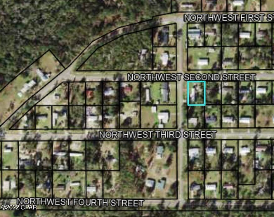 Neighborhood lot great place for a rental trailer or new construction. Trailer is not conveyed with the property.