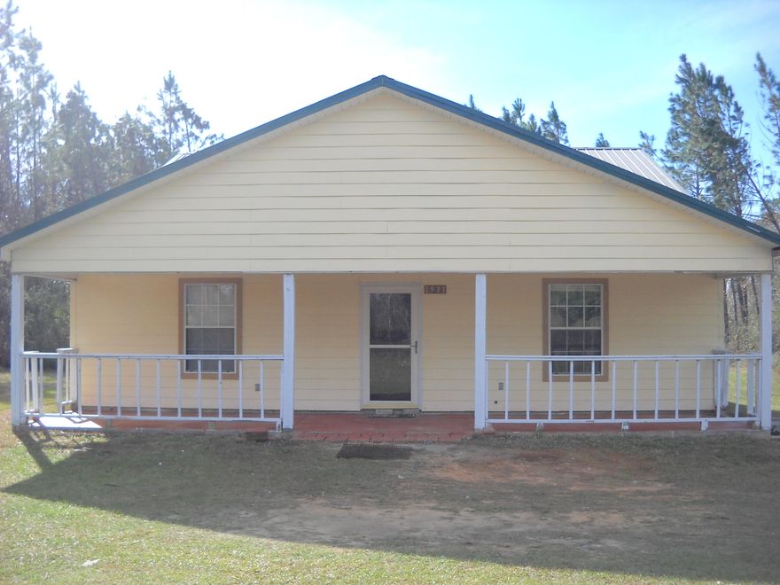 Well built custom home in 2008. Storm resistant Hardie board siding encapsulates this magnificent home. This beautiful home has an open floor plan with laminate, carpet and tile floor coverings, and stainless steel appliances.   Master bedroom has a spacious 6' x 14' WIC. A Sturdy metal roof with spray foam insulation in attic for exceptional energy efficiency caps off this construction masterpiece.   Large wooden deck perfect for grilling, or just hanging out with friends and family.  Very versatile 24' x 24' shop.  Shop is constructed on a concrete slab with metal roof and already wired with electrical outlets and lights.  Could continue to be utilized as exceptional shop or potentially converted into a guest suite.  This is a must see, call today to schedule your showing appointment.