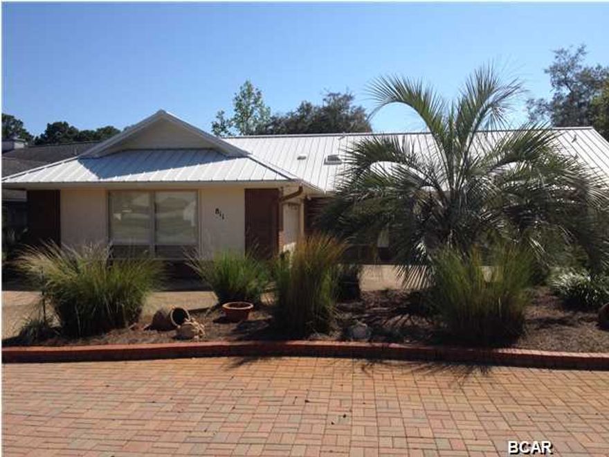 Don't miss your opportunity to own this immaculate brick updated golf course home located in desirable Bay Point! This home has been completely updated inside and out and is extremely well maintained. Features include 3 bedrooms, 2.5 baths, an updated kitchen offering granite counters, updated cabinets, stainless appliances, tile back splash and a great bay window breakfast area. The oversized family room with vaulted ceilings and a warm fireplace are a WOW! The master suite also features vaulted ceilings, another warm fireplace, direct access to the huge screened porch and hot tub. Master bath offers double vanities, dual walk in closets, a garden tub, separate shower and a beautiful stained glass window. The family room opens up to an enclosed covered porch and huge screened in  porch with a hot tub overlooking the golf course and gorgeous landscaped park like back yard. The oversized 2 car garage has tons of storage cabinets, it has a circular driveway and additional paver parking area, metal roof, newer doors and windows....IT REALLY IS A MUST SEE! On top of all that there is a transferable preferred golf and trail certificate which offers an amazing deal for golfers.