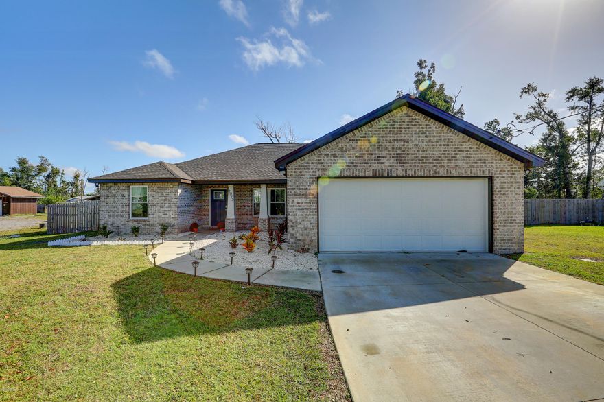 Come see this beautiful home on a double lot in Lynn Haven! This light brick home with a two car attached garage features gorgeous tile floor throughout the living spaces with carpet in the bedrooms, shiplap walls, granite counter tops in an open style kitchen with stainless steel appliances.  Large master suite with walk in shower, soaking tub, and large walk in closet complete with barn doors from bedroom. Back porch opens into large yard with privacy fence.  Walking distance to Sheffield Park where there are community activities including food trucks.  Don't miss this opportunity, it will go fast!

All sizes/info/measurements are approx, please verify if important.