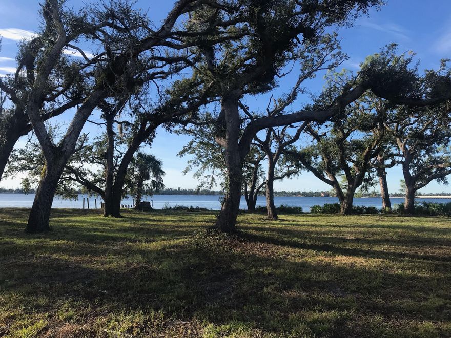 OVER 1 ACRE BAYFRONT!!! Potential development or perfect for your dream home or homes. Beautiful high and dry lot on North Bay. This truly is a one of kind piece of land on the bay.  Located just over the Bailey Bridge to the east. It is just across from the boat landing at Leslie Porter Park in Lynn Haven. It is also across from the popular Country Club but without any restrictions or HOA dues. It is very private with beautiful oak trees. There is an existing sea wall and pilings. This is a must see in person. Pictures do not do it any justice. If you are looking for a large bayfront lot in Bay County this is the land for you. A Please verify all important information.