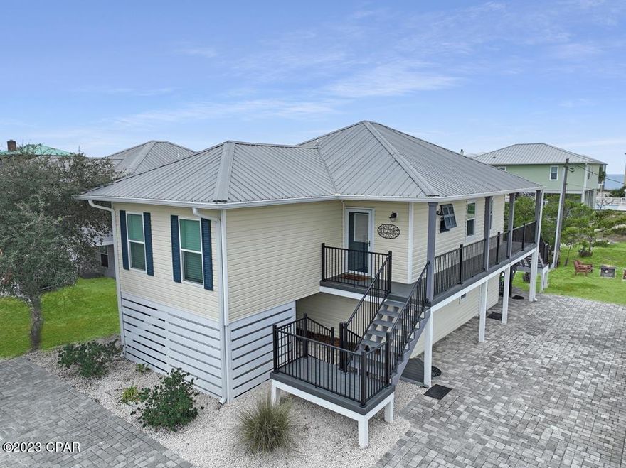 RELAX AND UNWIND IN THIS CHARMING BEACH RETREAT IN THE COMMUNITY OF TURTLE DUNES! If you're looking to live the beach life, 120 Cancun Drive checks all your boxes with 4BD/3BA and open concept living, luxury vinyl flooring throughout. This home is move-in and rental ready. The kitchen is equipped with a large center island, quartz counters, breakfast bar seating and stainless steel appliances. Included on the main level is a king guest suite with private full bath, a queen guest suite with a private full bath and an oversized bunk room. Downstairs you'll find another king suite and large full bath, with a separate living/entertaining area and private access to the outdoor space. Situated on over 1/4 acre, you have a large backyard, perfect for grilling and plenty of room for guests and boat parking. The gulf facing deck with new trex decking is the ideal spot for evening dining during the sunset & taking in the salt air breeze. You're steps away from the community pool and boardwalk beach access to the sugar white sand beach. HOA dues are reasonable and flood insurance may not be required in the X Flood Zone. Already an income producing property, this beautifully decorated home is sold fully furnished & rental ready and is convenient to everything Cape San Blas has to offer from fine dining, fresh seafood to recreation facilities and the public boat ramp. More photos and a 3D tour coming soon! Don't miss this opportunity to live the beach life! Call today for a showing and tour of the area.