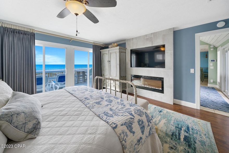 GULF FRONT!! With rental projections over $160,000,  this 3-bedroom, 3-bath Gulf-front beach house in Panama City Beach is a must see! Meticulously cared for, this beach house showcases 50 feet of sugar white sand frontage. Every detail reflects unparalleled care, from the decadent interior to the immaculate grounds.  Owners recently updated the home with a brand new metal roof and paved driveway with gated entrance.  The master bedroom and living room both have electric fireplaces and Gulf views, with windows all along the coastline.  The storm shutters help you close up with ease all along the back of the house. Each bedroom is spacious with great lighting, big window with shutters and closets that provide plenty of storage.  This home has an open concept and is perfect for entertaining. With room for a car to stay or a golf cart, the garage is incredibly organized and ready for all your toys! Call today to schedule a tour and I promise you won't be disappointed.