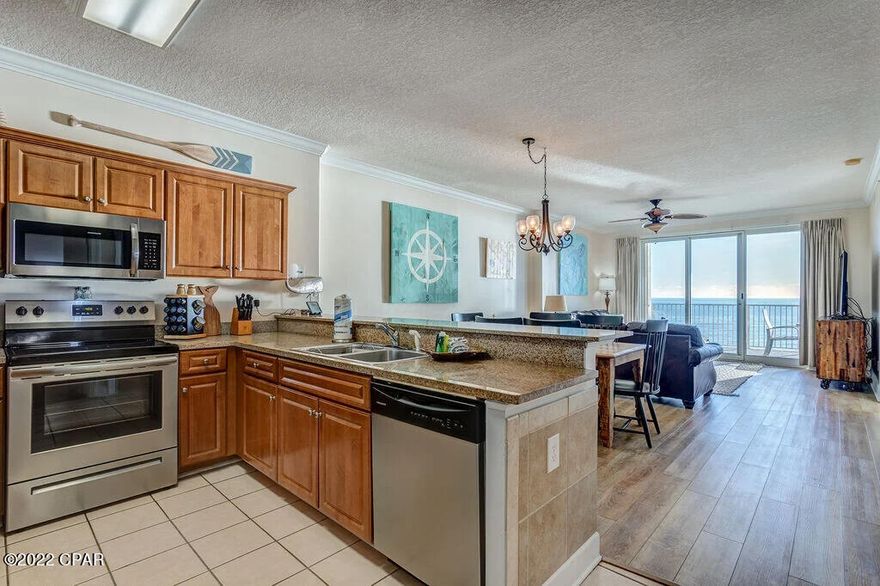 Beautifully decorated and appointed condo with amazing gulf front views on the desirable 5th floor.   Featuring a wonderful oversized balcony (271 square feet) and owner's storage closet right outside your front door.

This 2- bedroom, 2- bathroom condo is PERFECT and turnkey ready to be your home or investment rental on the beautiful Panama City Beach!   Generating over $50k in annual rental income.

From the 5th floor, you have amazing, wide- open ocean views with all the comforts of home. Step in and enjoy the open layout, which allows for tons of natural light to pour in. Enter into the property and step into the kitchen, featuring stainless steel appliances and granite counters and is fully stocked with all of the small appliances, utensils and items you need. Enjoy your morning coffee from the Keurig right at the kitchen bar, or head out to your private balcony and enjoy the sun rise over the Gulf Coast waters. You can enjoy a sit- down dinner with everyone at the dining table, which seats six. There is even a full dining set on the balcony to enjoy breakfast or just relax with a sunset cocktail. The living area features ample seating and a large, 65 inch flat-screen SMART TV, which is perfect for movie nights.
The Master Bedroom features a KING bed, with modern decor and its own ocean views. You can step straight onto the balcony and feel the ocean breeze! There is an en suite bathroom with a large vanity and a tiled, walk- in shower with glass door. There is a TV in this room as well, making it a true, relaxing retreat from a long day at the beach. 
The second bedroom also is also a KING suite, with plenty of storage, its own flat screen TV and its own en suite bathroom, which has a tub/ shower combination. A new Queen sleeper sofa is available in the living area if needed.
There are so many lovely touches in the property. A washer and dryer are located in the property for your convenience, vinyl and tile floors throughout, crown molding and all the fun of the beach is right outside your door. 
Ocean Villa is a 23-story condominium resort offering stunning views of the beautiful emerald waters and amazing sunsets of Panama City Beach from every condo and their private balcony. Centrally located in the heart of Panama City Beach, it is just a short distance from shopping, dining, entertainment and all of the local, favorite beach hang-outs. Ocean Villa amenities include a beach side pool, indoor/ outdoor heated pool, sundeck, hot tub, sauna, on-site fitness center, owner's lounge, dog park and gas grills. For your convenience, Ocean Villa has beachside covered parking as well as additional covered parking via walkover in parking garage across the street.