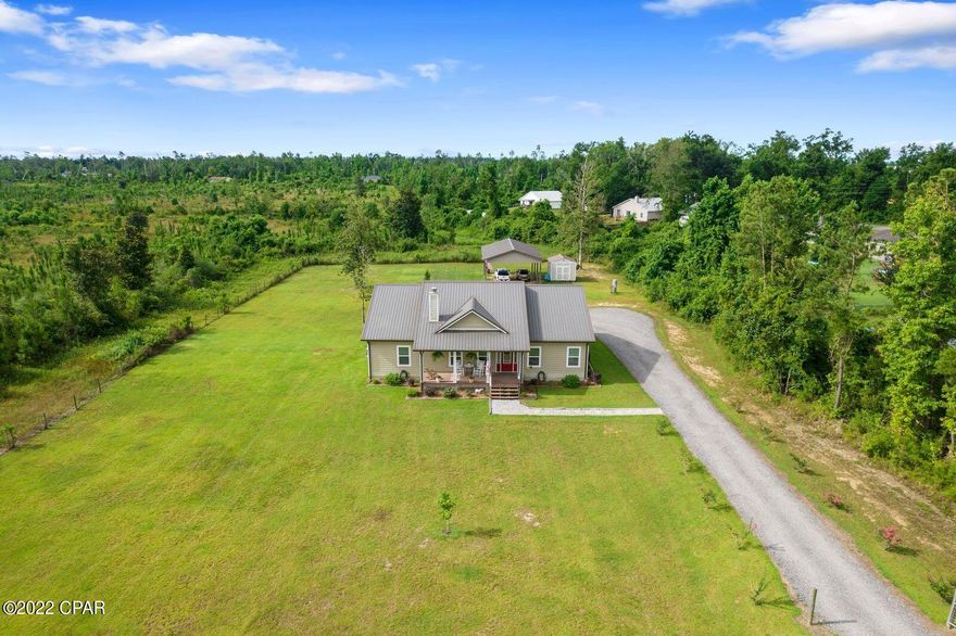 This amazing 2017 custom built home sits on a fenced 1.38 acre lot with a 24 x 36 pole barn fully equipped with power and utility shed. The home has beautiful hard wood floors and stainless steel appliances. The open concept design and custom 12 foot ceilings are rare finds in homes today and make the home feel very spacious. This home comes with a metal roof, plumbing cutoff manifold, and spacious covered front and back porches and a wood burning fireplace.  Finding a gorgeous home on spacious land and away from the noise of neighbors and busy roads is rare in todays market. The home is a short drive from I10 which makes commuting a breeze. Call today to schedule your showing.