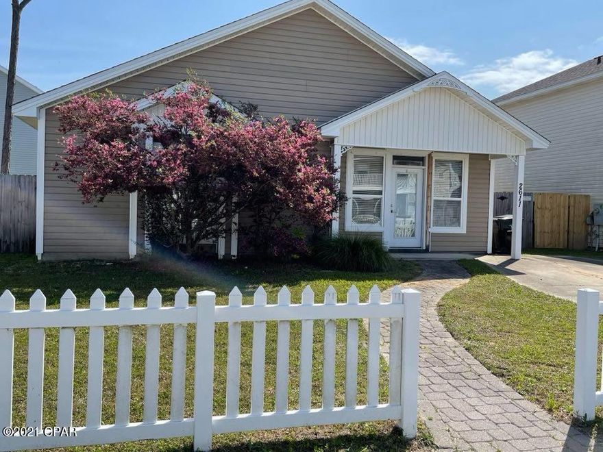 This home features 3 bedrooms with 2 baths  The living room features beautiful hardwood floors and is open to the eat-in kitchen area with a breakfast bar, solid surface countertops, ceramic tile flooring, beautiful contemporary custom cabinets and stainless steel appliances. The master bedroom is large with an oversized window and tray ceiling and has a large walk-in closet, and private tiled master bath. There are 2 additional bedrooms and a full bath as well as an enclosed laundry area off the hall