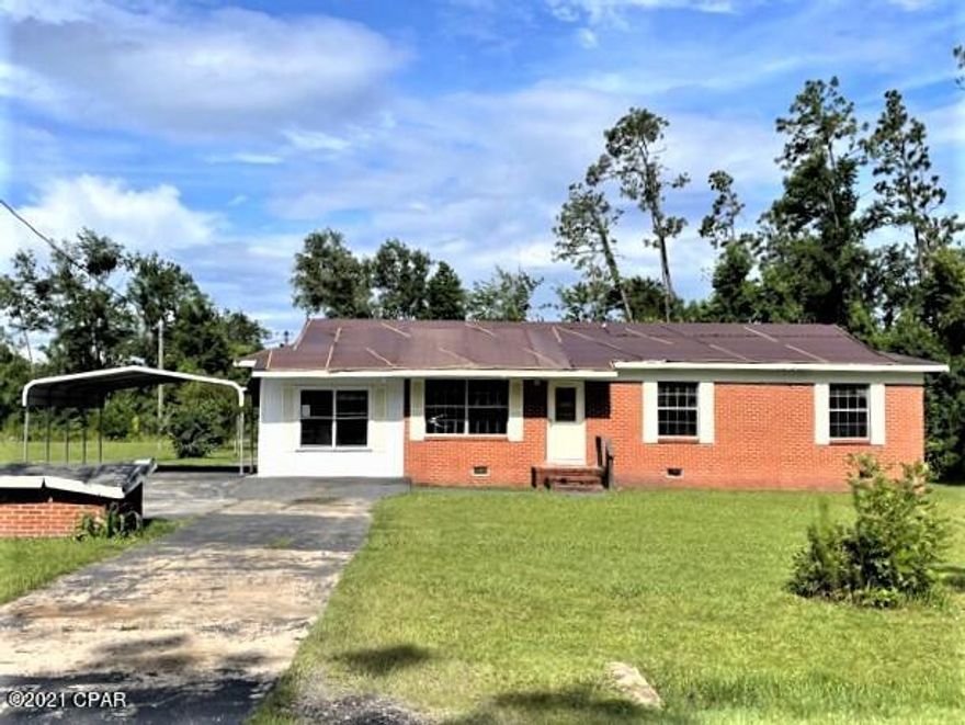 Brick single family residence  with repairs and updates needed.   It has a large master bedroom with adjoining sitting room.  The 2nd bedroom exists from the garage that was enclosed making it into a bedroom.   There is a large den that overlooks the large back yard.   The lot is very large.  You have lots of room for garden here, There is a storage shed in the back​​‌​​​​‌​‌​​​​‌​​‌​​​​‌‌ yard.