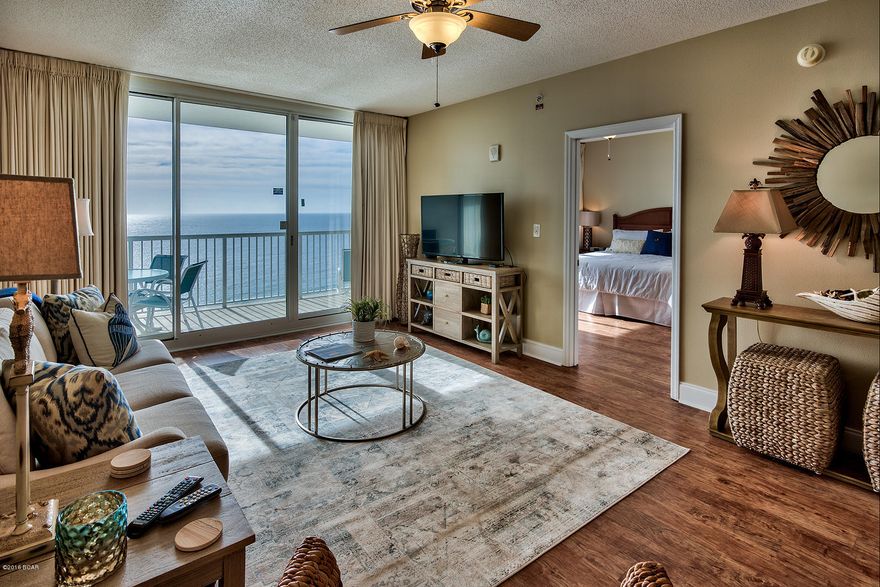 Experience peaceful, color drenched sunsets, and feel the cool ocean breezes, all while in this wonderful gulf front 3 bedroom, 2 bathroom unit in Majestic Beach Tower, one of Bay County’s premier high rise condominium complexes. Long coveted by residents, tourists, and investors for its beauty and access to 650 feet of beach frontage, here you can take advantage of everything this world class property offers. With upgrades throughout, this spacious and airy residence is beautifully furnished in a relaxing and comfortable style. Take note of the high ceilings, which offers natural light throughout. The kitchen boasts stainless steel appliances, including new dishwasher, modern cabinets, and bar seating for those informal meals or conversation. ep into the living room, and find new, high quality furniture, hardwood flooring, large flat screen television and lots of accessories that will make this feel like home. The private balcony, with new patio furniture, has unbeatable panoramic gulf views, and serves as the perfect location for alfresco dining, or lounging after a fun filled day. The gulf facing master bedroom was designed with warmth and serenity in mind. Painted in appealing neutral tones, this retreat provides private access to the outdoor balcony. The two additional guest rooms continue with unmatched style and charm, while providing ample space for family or guests. Revel in a true Florida lifestyle by enjoying all of the amenities provided by Majestic Beach Tower. Soak in the sun at the fabulous two outdoor swimming pools or bask in the two heated indoor pools. A fitness center, two tennis courts, arcade, convenient garage parking and even a Starbucks are here as well. With nearby shopping and dining, discover why this home offers the ultimate in beach living in Northwest Florida.