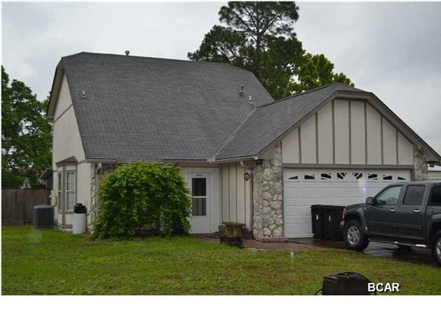 Well maintained two story home located in a very popular, established neighborhood close to Tyndall Air Force Base. This home features a split bedroom plan with the master bedroom suite on the first floor and two bedrooms, full bath and a loft area on the second floor. The living area is open to the dining area and separated by a breakfast bar. The galley style kitchen has a full appliance package and a great amount of storage space. For outdoor living, there is a screened in Florida Room overlooking the back yard deck and above ground pool. For car and boat storage there is an attached two car garage plus an attached car port and storage shed. This home is the perfect home in the perfect neighborhood. Call today!!!