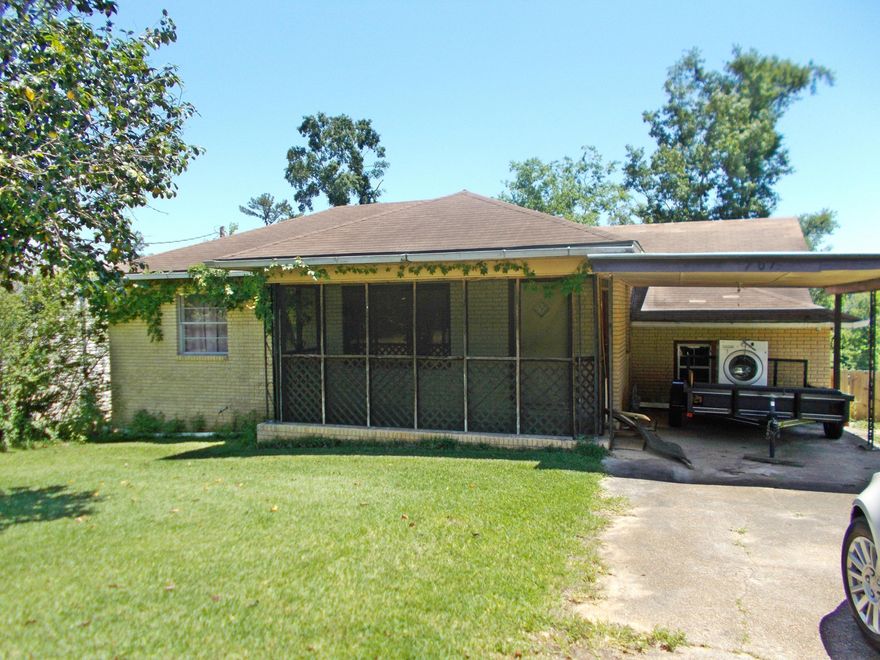 3/2 in town with 2 lots and road frontage on 3 sides, the home needs some flooring, updates and some TLC but could be made into  a nice home, the other lot joins this  one but has a parcel number and legal and could be sold to help with repairs to the home.