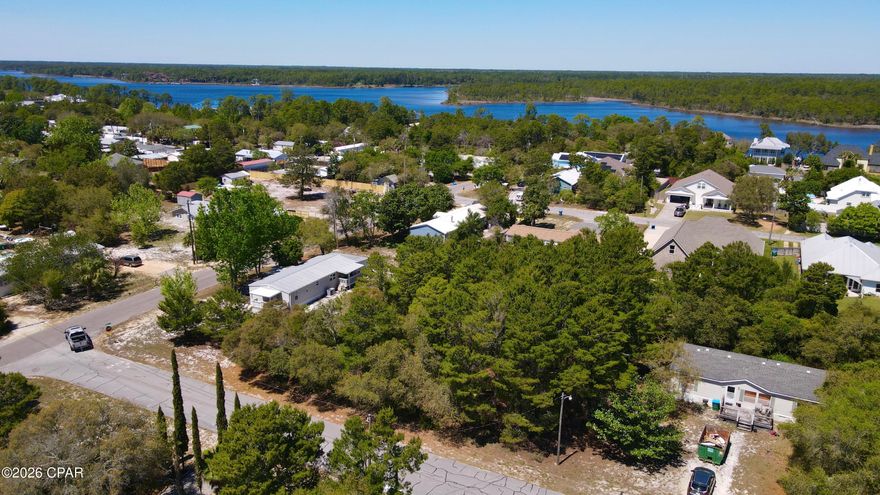 Situated on just under HALF AN ACRE, this property offers the space, flexibility, and location that's getting harder to find in Panama City Beach. Whether you're looking to build, invest, or create your own coastal retreat, the possibilities here are wide open.

Tucked away in a quiet area while still close to everything, you're just a short drive to BEACH ACCESS along the Gulf, where white sand and emerald water set the tone for everyday living. Spend your mornings by the water, afternoons out on the boat, and evenings enjoying the privacy of your oversized lot.

For boating and outdoor enthusiasts, a NEARBY PUBLIC BOAT RAMP provides easy access to Lake Powell and the surrounding waterways, making it simple to get out on the water whenever you want.

The generous lot size--approximately 0.41 acres--gives you room for all the extras: store your boat or RV, add a workshop, create outdoor living space, or design the home you've been envisioning.

Conveniently located near shopping, dining, and the growing West End of PCB, this property combines a laid-back coastal feel with everyday accessibility.

If you've been searching for space, location, and potential all in one--this is it.