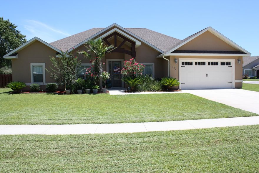 Beautiful modern craftsman home in the prestigious waterfront community of Colony Club/Holiday Golf Course. This Custom Built four bedroom, three bath home has a formal dining room as well as a  dedicated office and an open/split floor plan. This is the Builder's Home, and therefor has many upgrades not found in other homes in the area! Some of the numerous features include, crown molding in all common areas, 11 ft. coffered ceilings, wood look porcelain tile and frieze carpet, high efficiency HVAC system, oversized garage with 8' tall garage door, 8' tall entry door system. The open gourmet kitchen boasts 42" solid wood cabinetry, granite counter tops, stainless appliances, brushed nickel faucets, breakfast bar with pendant lights and a walk-in pantry. The spacious great room has a  11 ft coffered ceiling, with recessed lighting and French doors that lead to the covered patio. The large master bedroom has an 11  ft tray ceiling. The luxurious master bath features an extended double vanity with make up area, a garden tub, and oversized tiled shower with two shower heads. The exterior amenities include automatic irrigation system,,privacy fenced corner lot, and fully landscaped yard. Colony Club is conveniently located about two miles from Pier Park Shopping and numerous restaurants.