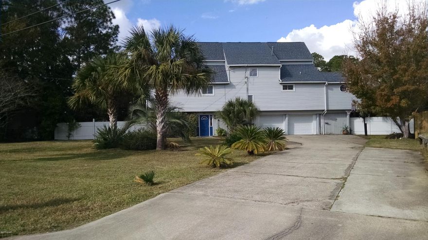 This tri-level home is perfect for the modern family with 2 full bedrooms and 1 bathroom on the top level, the master bedroom, bathroom and office/nursery on the main, middle level and a large bonus room/man cave on the bottom level which has a half bath and access to the large 2 car garage. The bonus room has a window air conditioner and is not included in the heated and cooled square footage, making this home larger than it seems. Each of the 3 bedrooms have their own private balconies overlooking the water and boathouse and the living room has a screened in porch overlooking the water as well. Room sizes are approximate, please measure if important